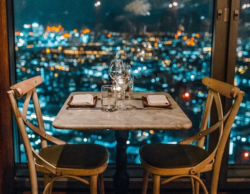 white ceramic table and chairs with glassware